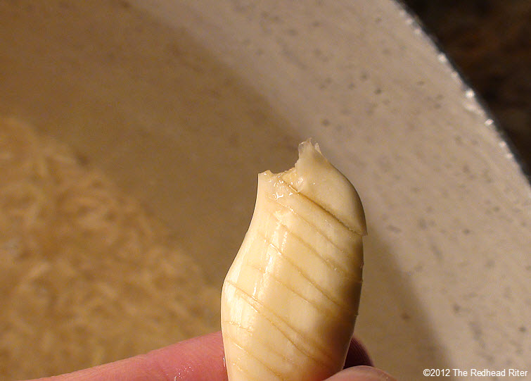 sliced whole garlic in rice water 10